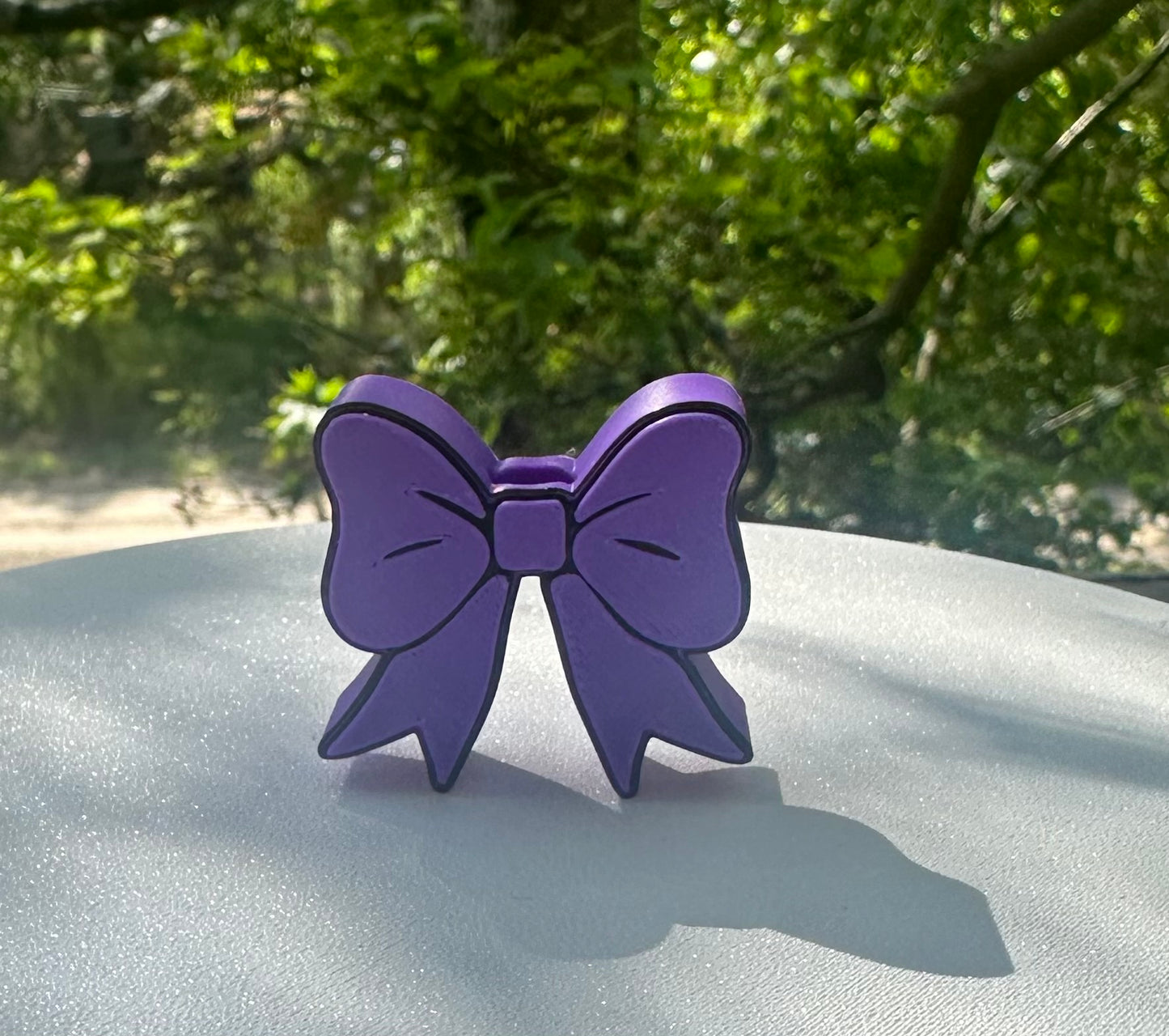 Purple and black bow straw topper