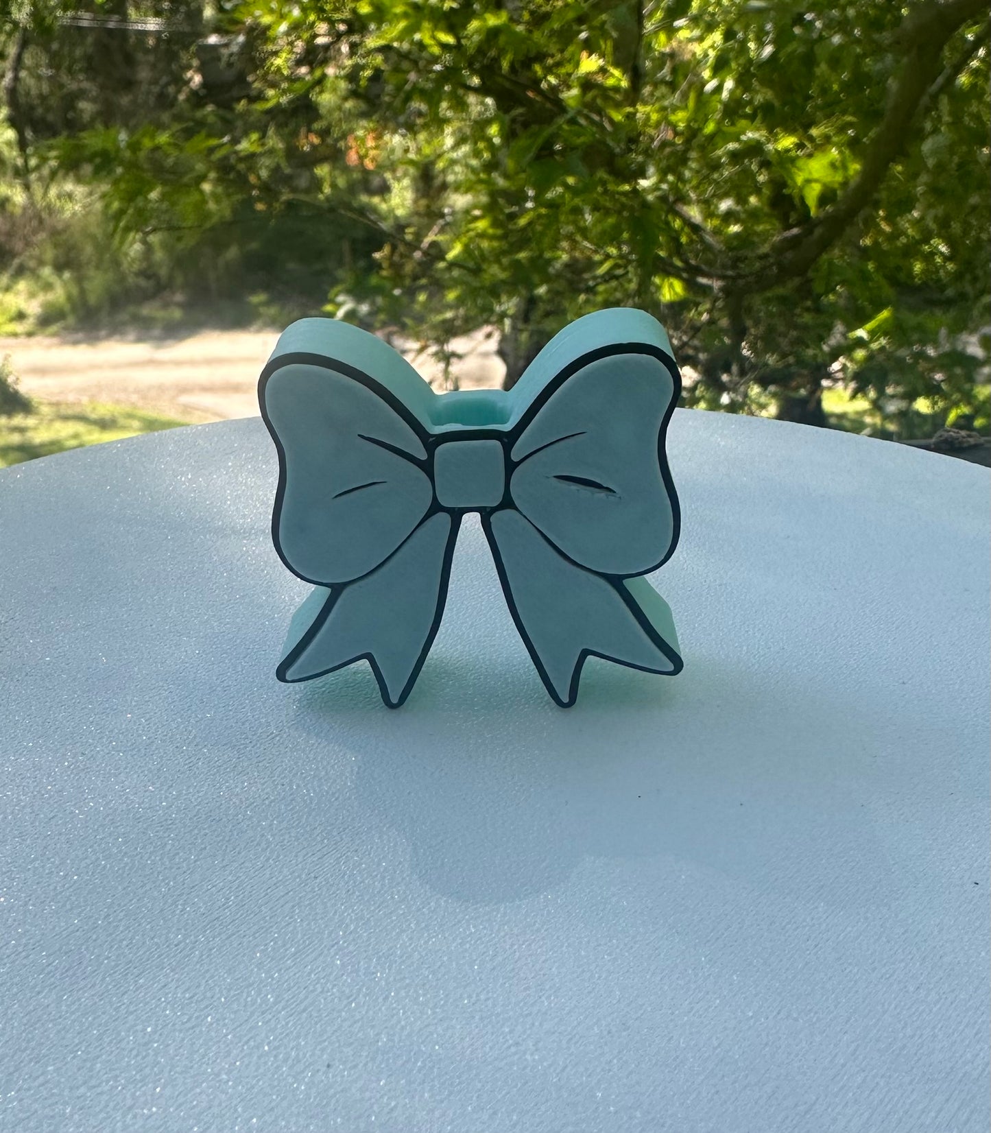 Blue and black bow straw topper